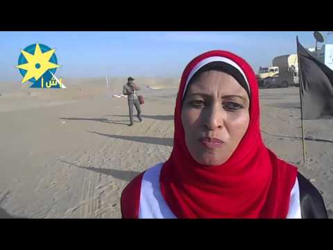 سيدة ترتدي علم مصر تزور قناة السويس