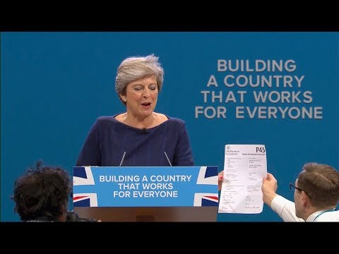 protester disrupts british pm theresa