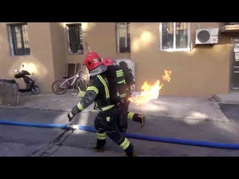 firefighter in china races out of housing block