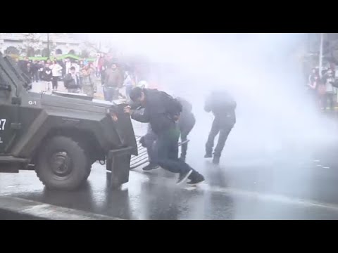 police in chile fire water cannon in student clashes