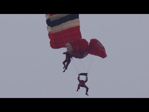 army parachutist rescues teammate