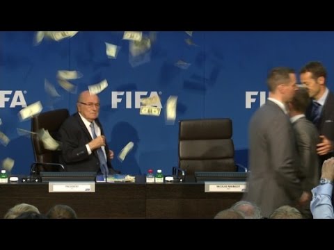 comedian throws money at blatter