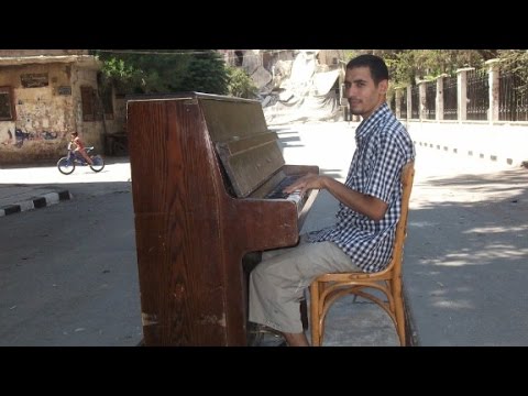 daesh destroyed his piano but he plays on