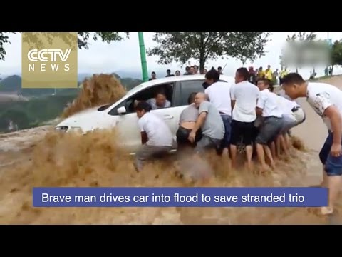 brave driver enters flood to save stranded trio