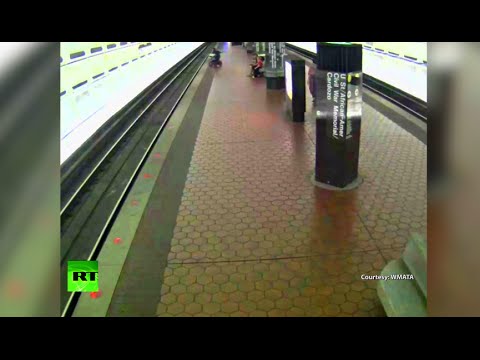 man in wheelchair falls on rails