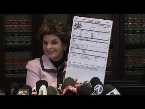 allred holds up cosby arrest warrant