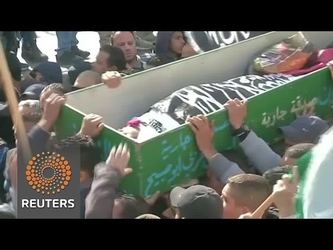 as palestinians bury their dead